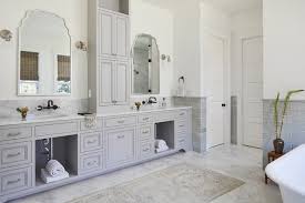 One center column of drawers and dual cabinet doors open to large interior storage with one shelf on each side. 9 Ideas For The Space Between Double Sinks In The Bathroom