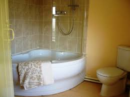 Small Corner Tub And Shower Combo With Glass Wall Panel Corner Tub Shower Corner Tub Shower Combo Corner Bathtub Shower
