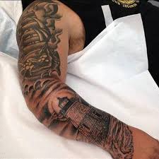 Nautical star tattoos placed on a cross tribal style tattoo ideas for men. Top 75 Best Sailor Tattoos For Men Classic Nautical Designs