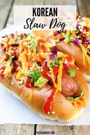 These Korean Slaw Dogs Are An Amazing Game Day Favorite All Beef Hot Dogs Loaded With Korean Bbq Sauces Spicy Kimchi Slaw Dog Dog Recipes Hot Dog Recipes