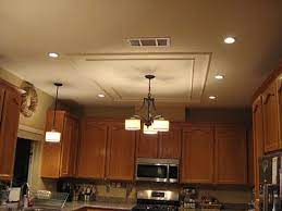 Are you planning on placing recessed cans in the locations that the existing lights are or are you planning on repositioning light locations? Love This Kitchen Lighting Update I Have Really Got To Learn How To Rewire Things Myself Kitchen Lighting Recessed Lighting Kitchen Lighting Recessed