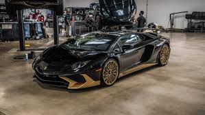 The miura logo in black steel on the side, the limited edition. Black And Gold Lamborghini Aventador S Is One Of The Last Carscoops Lamborghini Aventador Gold Lamborghini Lamborghini