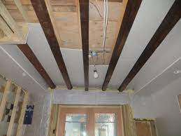 The main way to do that is to use sturdy boards that won't bend, which means that you should use thicker ones. Kitchen Drywall Resumes The Hardest Part Low Ceiling Basement Basement Ceiling Options Basement Ceiling