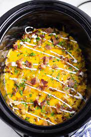 This crock pot breakfast casserole includes hash brown potatoes, eggs, vegetables, and ham. Crockpot Breakfast Casserole The Gracious Wife