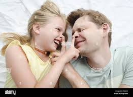 Daughter jumping in air hi-res stock photography and images