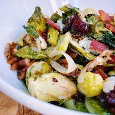 These roasted brussels sprouts with crispy bacon & creamy cheese sauce are perfect for those who are convinced that they don't like brussels sprouts! Bacon Blue Cheese Brussels Sprouts The Fit Feed By Reed