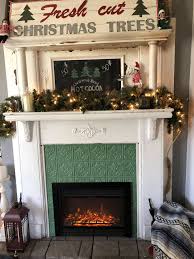 You should consider features while shopping for an electric fireplace, too. Antique Mantel Electric Fireplace Insert Plus Faux Tin Tile From Amazon Painted The Bes Vintage Fireplace Antique Fireplace Mantle Victorian Fireplace Mantels