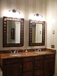 In this bathroom, the mirror's blue leather outer layer is the perfect transition between the formal elements, like the intense vanity base, marble surface, and black walls, and the the playful. Bathroom Mirror Images Dream Home Design