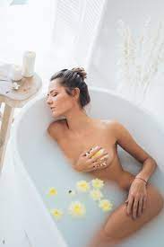 Nude Woman Lying in White Bathtub · Free Stock Photo