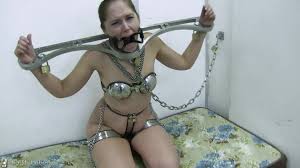 BoundHub - Rachel in metal restraints