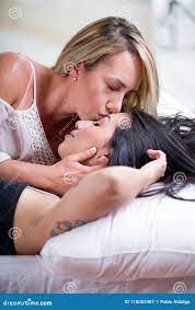 Close Up of a Lesbians Lovers in Bed at Morning, Blonde Kissing at  Forefront of Brunette Girl, in a White Stock Image - Image of club, beauty:  110003407