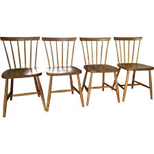 Chair frames are assembled from hardwood, stained and lacquered while the cushioned parts are built separately. Vintage Scandinavian Spindle Back Dining Chairs Set Of 4 For Hagafors Stolfabrik Ab 1950 Design Market