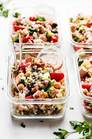 Mediterranean couscous salad made with chewy pearl couscous, pomegranate seeds, arugula with a sweet and sour dressing and topped with chopped pearl couscous combined with vegetables and then dressed up in a sweet and sour homemade dressing. Greek Couscous Salad Garnish Glaze