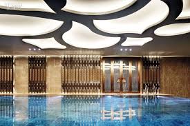 P Class P1 A Swimming Pool At The Wanda Reign Chengdu Nbsp Span Photography Courtesy Of The Wanda Hotel Design Hotels Design Indoor Design Ceiling Design