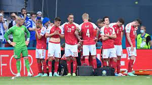 Christian eriksen of denmark goes down injured as teammates call for assistance during the uefa euro 2020 match between denmark and finland / © martin meissner. Ba3dxejgcwj0 M
