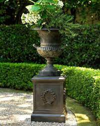 Maybe you would like to learn more about one of these? Classic Urn Planter Laurel Wreath Pedestal Urn Planters Flower Pots Outdoor Garden Urns