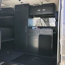 It's the only camper van in all of hawaii that boasts a custom luxury interior with shaker style cabinets, shiplap walls, herringbone table, granite countertops, brushed nickel hardware, and a stainless steel. Van Cabinets Tables Storage Options Bearfoot Theory