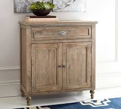 An upright, cupboardlike repository with shelves, drawers, or compartments. Astoria Storage Cabinet Rosedale Brown Pottery Barn