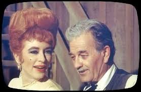 It might have been the old west but even Miss Kitty had a bouffant hairdo  and Cleopatra eyes in the early 60's episodes of 'Gunsmoke'