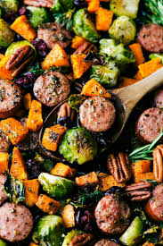 An Easy One Pan Meal Harvest Sausage And Seasoned Veggies Baked Together And Topped With Dried Cranberries And Pecans Baked Veggies Seasoned Veggies Recipes