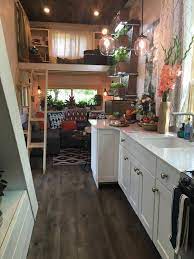 Ever Growing Tiny House Tiny Living The 330 Sq Ft Ever Growing Tiny House Features A Custo Tiny House Interior Small House Kitchen Design Tiny House Kitchen