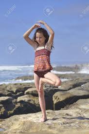 Maybe you would like to learn more about one of these? Young Girl Performs Vrksasana Yoga Tree Pose On Beautiful Rocky Stock Photo Picture And Royalty Free Image Image 20419873