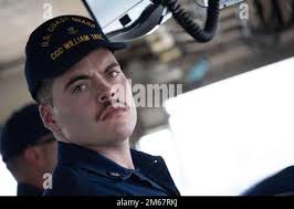 Petty Officer 3rd Class Evan Dumke, a crewmember at stationed at Coast  Guard Sector New York, eats lunch with members of his group during Project  Hope at P.S. 111 Adolph S. Ochs,