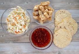 To assemble the egg rolls, place 1/4 cup of chopped cabbage in the bottom corner of the egg roll wrapper; Baja Style Fish Tacos With A Sweet Chili Sauce Chef Dennis
