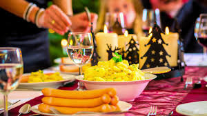 Family christmas dinner sausages and potato salad. German Christmas Traditions Ancestral Findings