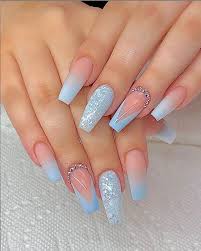 It is highly recommended to go back to the nail technician or the subtle gold sparkles and nail gems blend perfectly with the baby blue hue. Glitter Acrylic Nails