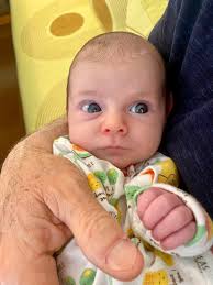 1 month with Izzy Evelyn. Her favorite hobbies are sleep squawking, gettin  strolled in her stroller, and causing mastitis. For me, it wasn't instant  overwhelming love at first sight like you're supposed