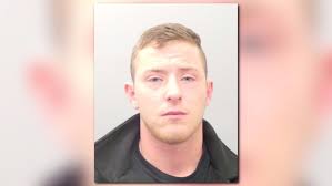 Man charged for crashing into squad car