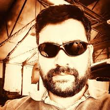 What improvements have you noticed after updating the Epson LS12000  firmware?