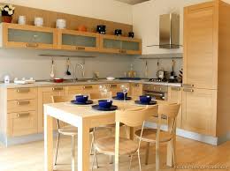 This mondrian inspired kitchen by ande bunbury architects has basic cabinetry transformed with different color paint for colorful accents including the yellow light fixture and teal kitchen clock add several splashes of visual interest. 20 Modern Wood Kitchen Cabinets Magzhouse