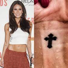 Cross tattoo on wrist with lovely design. Brittany Furlan Cross Wrist Tattoo Steal Her Style
