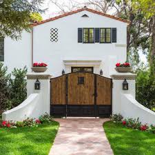 The gate features a simple tongue and groove backdrop with horizontal and vertical trim that create a minimalistic spanish colonial style. Spanish Style Driveway Gate Houzz