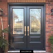 Gainsborough bright goldtone double cylinder trilock traditional knobset. Brick Walls Double Doors And Baldwin Satin Nickel Hardware A Design Trifecta In Residential Front Doors Double Front Entry Doors Front Door Ideas Brick House