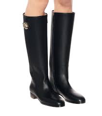 Kendall sits on the floor in a gray and green bikini. Leather Knee High Boots Gucci Mytheresa