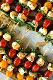 Super easy finger foods are the perfect way to kick off a party. Mini Caprese Skewers Vegetarian Appetizers Appetizer Recipes Vegetarian Finger Food
