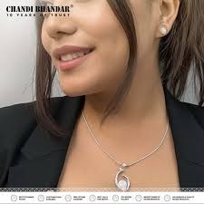 Dive into elegance! Swipe left to explore our pendant carousel, where every  piece gleams with the sparkling beauty of American diamonds. Each pendant  tells its own story of style and sophistication. Take