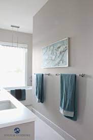 Still light and bright, without being white. Bathroom With Marble Floor Teal Accents Freestanding Tub Benjamin Moore Balboa Mist A Warm Gray Greige Paint Co Teal Bathroom Best Gray Paint Greige Paint