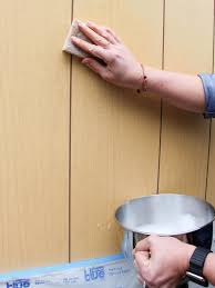 Fill any holes or cracks with wood putty, using a putty knife, and allow it to dry. How To Paint Over Wood Panel Walls How Tos Diy
