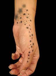 Star Dust Tattoo Star Tattoo On Hand Hand Tattoos For Women Cool Wrist Tattoos