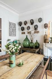 Beautifully Collected Decor Ideas Hats On The Wall Large Green Vintage Bottles Mixing Old With New Decor Wood Dining Room Swedish Decor Home Decor Styles