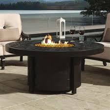 A fire pit table can provide patrons both warmth and illumination: Castelle Classical Industrial Brown Aluminum Round Outdoor Firepit Coffee Table Kathy Kuo Home