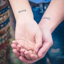 The infinity symbol combines 'faith' and 'hope' written in words with for love, there is a heart symbol that represents the emotion. 8 Tattoos As Symbols Of Love Self Tattoo