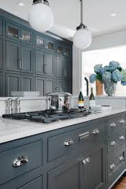 Another alternative is to mix and match a lighter gray for the upper/top cabinets and a darker gray for the bottom/lower cabinets. Decorating 101 Grey Kitchen Cabinets Adore Interiors Home Staging Interior Design Furniture Lighting