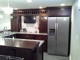 There is a flat screen tv on top of the wall that is directly opposite the sitting area behind the bar counter. Options For Wet Bars Basement Finishing Columbus Oh Basements Unlimited
