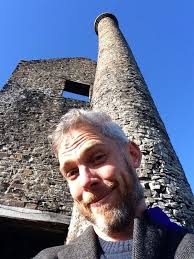 Sam Willis by an old tower.