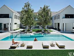 Von Furstenberg Looks On As Miller Takes A Dip In The Terrazzo Lined Swimming Pool The Lounge Chairs Are By Summit Fur Pool Houses Courtyard Pool Luxury Pools